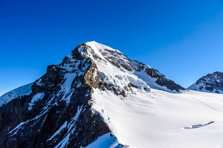 Moench mountain - View of the mountain Moench in the Bernese Alps in Switzerland - travel destination in Europeの写真素材