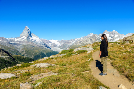 Matterhorn - Hiker in beautiful landscape of Zermatt, Switzerlandの写真素材