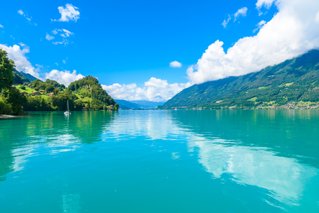 Village Iseltwald at Lake Brienz - beautiful lake in the alps at Interlaken, Switzerlandの写真素材