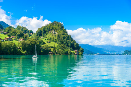 Village Iseltwald at Lake Brienz - beautiful lake in the alps at Interlaken, Switzerlandの写真素材