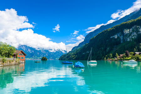 Village Iseltwald at Lake Brienz - beautiful lake in the alps at Interlaken, Switzerlandの写真素材