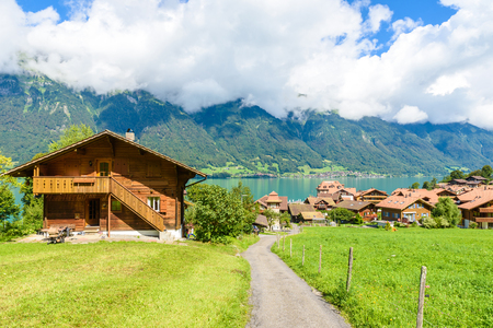 Village Iseltwald at Lake Brienz - beautiful lake in the alps at Interlaken, Switzerlandの写真素材