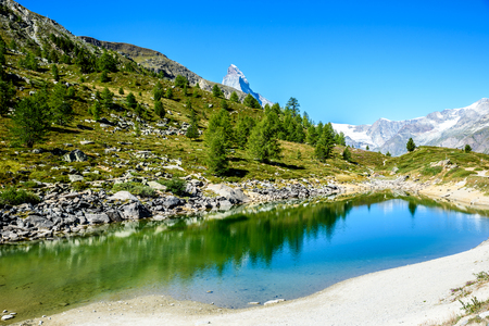Gruensee (Green lake) with view to Matterhorn mountain - trekking in the mountains near Zermatt in Switzerlandの写真素材