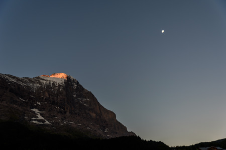 Eiger north wall - view to Eiger from Grindelwald in  in the Bernese Alps in Switzerland - travel destination in Europeの写真素材
