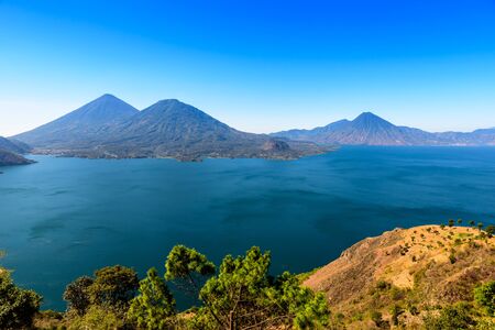 Panorama view of the lake Atitlan and volcanos  in the highlands of Guatemalaの写真素材