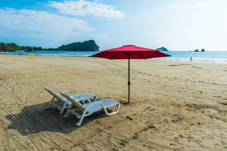 Parasol with chairs at Playa Espadilla at Manuel Antonio Park - Costa Ricaの写真素材