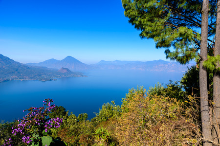 Panorama view of the lake Atitlan and volcanos  in the highlands of Guatemalaの写真素材