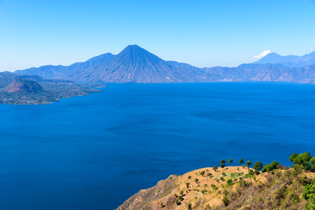 Panorama view of the lake Atitlan and volcanos  in the highlands of Guatemalaの写真素材