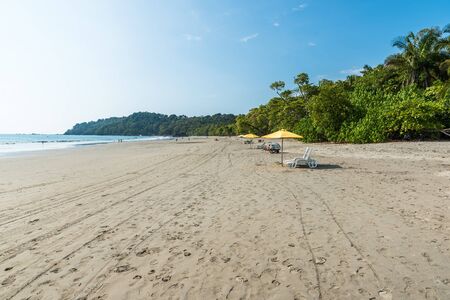 Parasol with chairs at Playa Espadilla at Manuel Antonio Park - Costa Ricaの写真素材