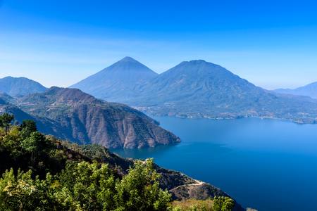Panorama view of the lake Atitlan and volcanos  in the highlands of Guatemalaの写真素材