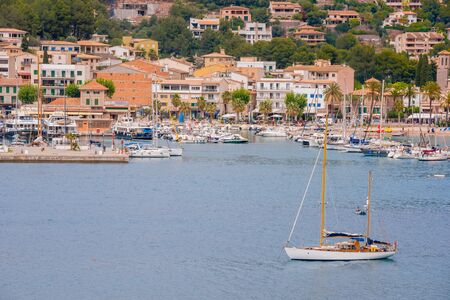 Puerto de Soller, Port of Mallorca island in balearic islands, Spain. Beautiful  beach and bay with boats in clear blue water of summer day.のeditorial素材