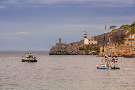 Puerto de Soller, Port of Mallorca island in balearic islands, Spain. Beautiful  beach and bay with boats in clear blue water of summer day.の写真素材