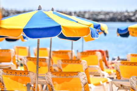 Sun umbrellas at sunny beachの写真素材