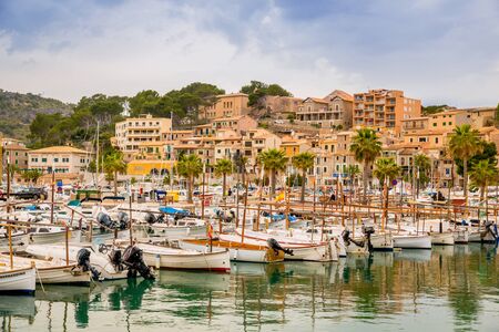 Puerto de Soller, Port of Mallorca island in balearic islands, Spain. Beautiful  beach and bay with boats in clear blue water of summer day.の写真素材