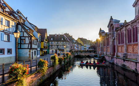 Beautiful view of the historic town of Colmar, also known as Little Venice, boat ride along traditional colorful houses on idyllic river Lauch in summer, Colmar, Alsace, Franceのeditorial素材
