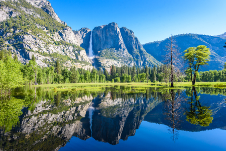 Yosemite National Park - Reflection in Merced River of Yosemite waterfalls and beautiful mountain landscape, California, USAの写真素材