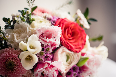 Wedding bouquet - Beautiful flowers in bride's hands in a white dress.の写真素材