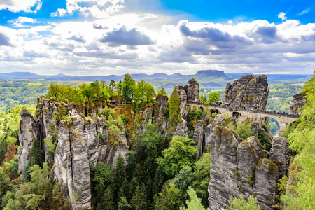 Panorama view on the Bastei bridge. Bastei is famous for the beautiful rock formation in Saxon Switzerland National Park, near Dresden and Rathen - Germany. Popular travel destination in Saxony.の写真素材
