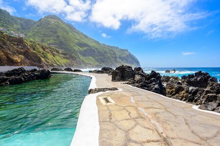 Natural volcanic swimming lagoon pools at Porto Moniz, travel destination for vacation, Madeira island, Portugalの写真素材