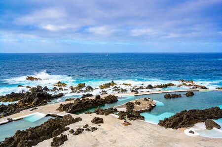 Natural volcanic swimming lagoon pools at Porto Moniz, travel destination for vacation, Madeira island, Portugalの写真素材