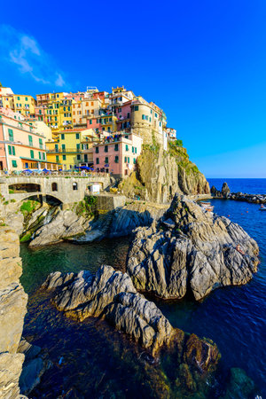 Colorful houses in Manarola Village in Cinque Terre National Park. Beautiful scenery at coast of...
