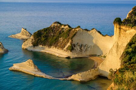 Cape Drastis at sunset close to Peroulades and Sidari village - Beautiful coast scenery with High cliffs and paradise beach - Corfu, Ionian island, Greeceの写真素材