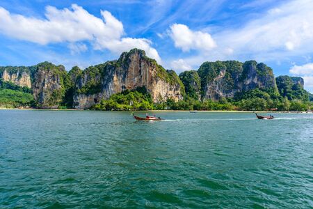 Railay West Beach with beautiful rock formation and landscape scenery in Krabi province - tropical coast with paradise beaches - Thailandの写真素材