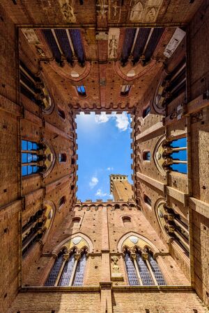 Siena - View from inside the Palazzo Pubblico at Piazza del Campo - old historic city in Italyの写真素材