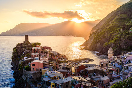 Vernazza - Village of Cinque Terre National Park at Coast of Italy. Beautiful colors at sunset. Province of La Spezia, Liguria, in the north of Italy - Travel destination and attraction in Europe.の写真素材