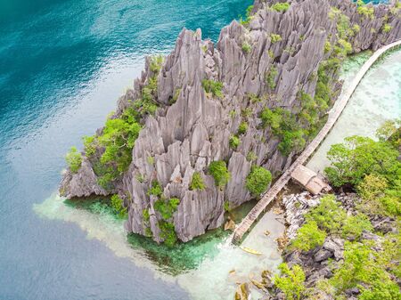 Aerial view of Twin Lagoon on paradise island with sharp limestone rocks, tropical travel destination - Coron, Palawan, Philippines.の写真素材