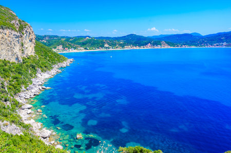 Agios Georgios beach at paradise bay in beautiful mountain scenery, Corfu island, Greece