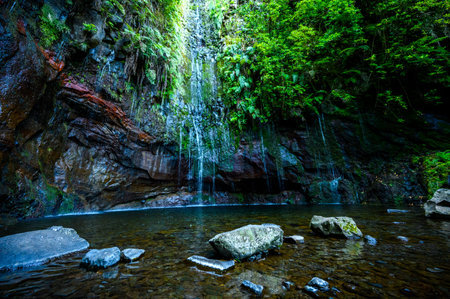 Risco Waterfall - Hiking on Levada trail 25 Fontes in Laurel forest at Rabacal - beautiful landscape...