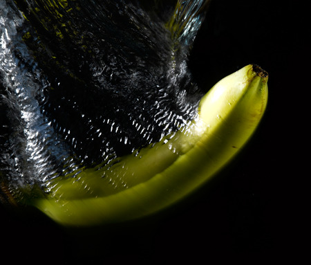 Fruit thrown in waterの写真素材