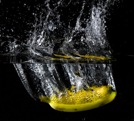 Fruit thrown in waterの写真素材