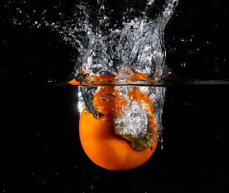 Fruit thrown in waterの写真素材