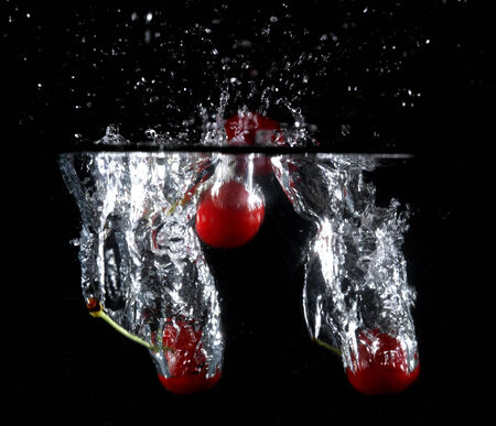 Fruit thrown in waterの写真素材
