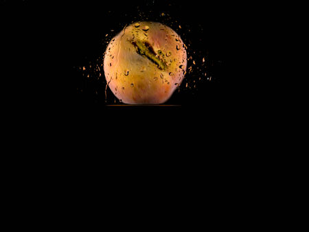 Fruit thrown in waterの写真素材