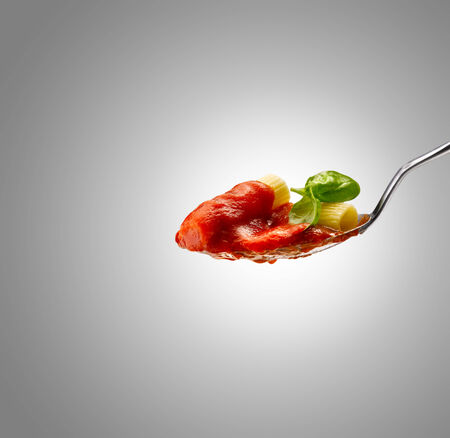 Basil pasta and tomato sauceの写真素材