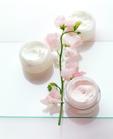 Cream jars with Wickeの写真素材