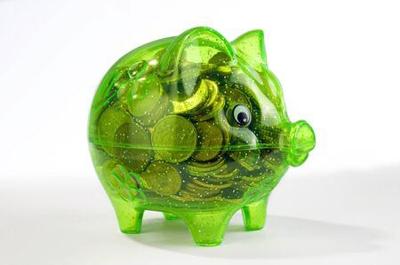 green piggy bank isolated on white の写真素材