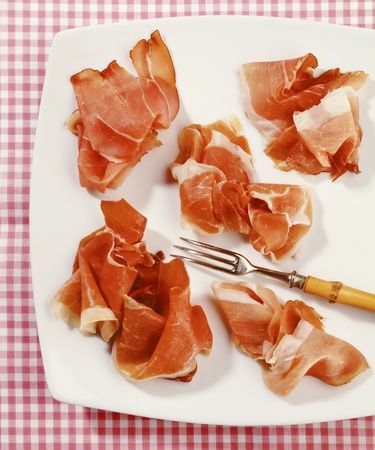 smoked ham on white plate の写真素材