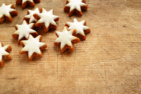 cinnamon stars biscuits over wooden backgroundの写真素材