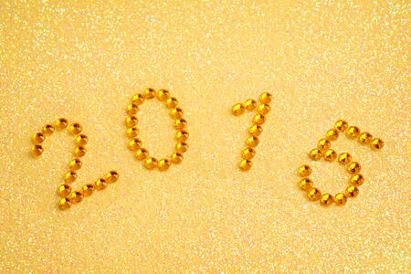 2015 over golden backgroundの写真素材