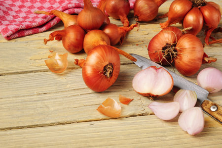 Shallots on wooden board