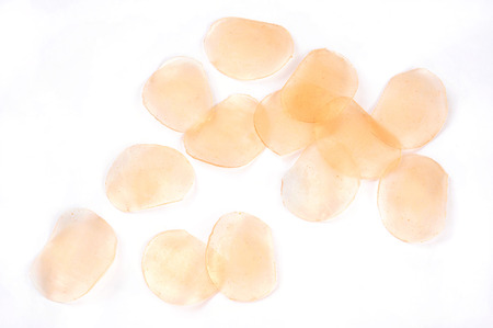 raw prawn crackers isolated over white backgroundの写真素材