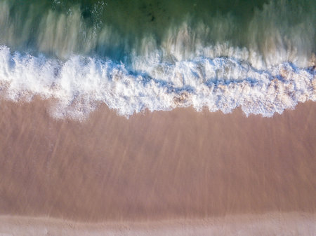 Drone picture of the waves hitting the beach on the Swahili Coast, Tanzania.