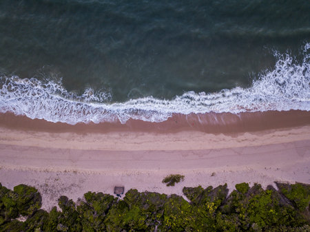 Drone picture of the waves hitting the beach on the Swahili Coast, Tanzania.