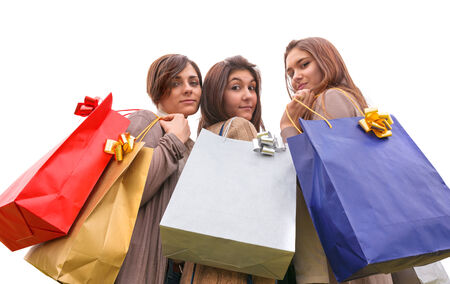 group of girls make shopping with colored bagsの写真素材