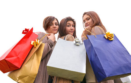 group of girls make shopping with colored bagsの写真素材