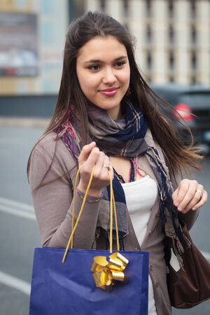 group of girls make shopping with coloured bagsの写真素材